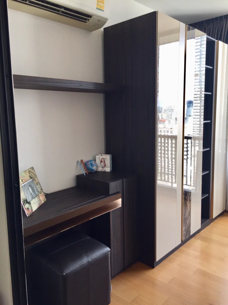 For rent: Noble Revo Silom, very high floor unit, fully furnished and ready to move in. Offers a partial view of the Chao Phraya River. Includes all a