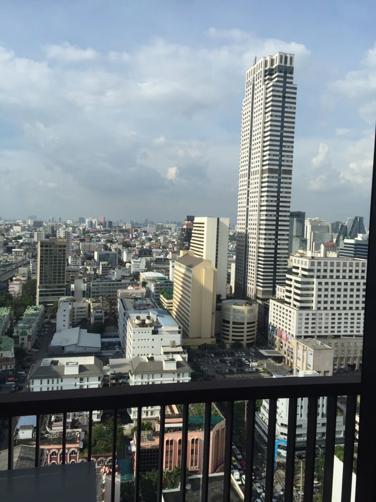 For rent: Noble Revo Silom, very high floor unit, fully furnished and ready to move in. Offers a partial view of the Chao Phraya River. Includes all a