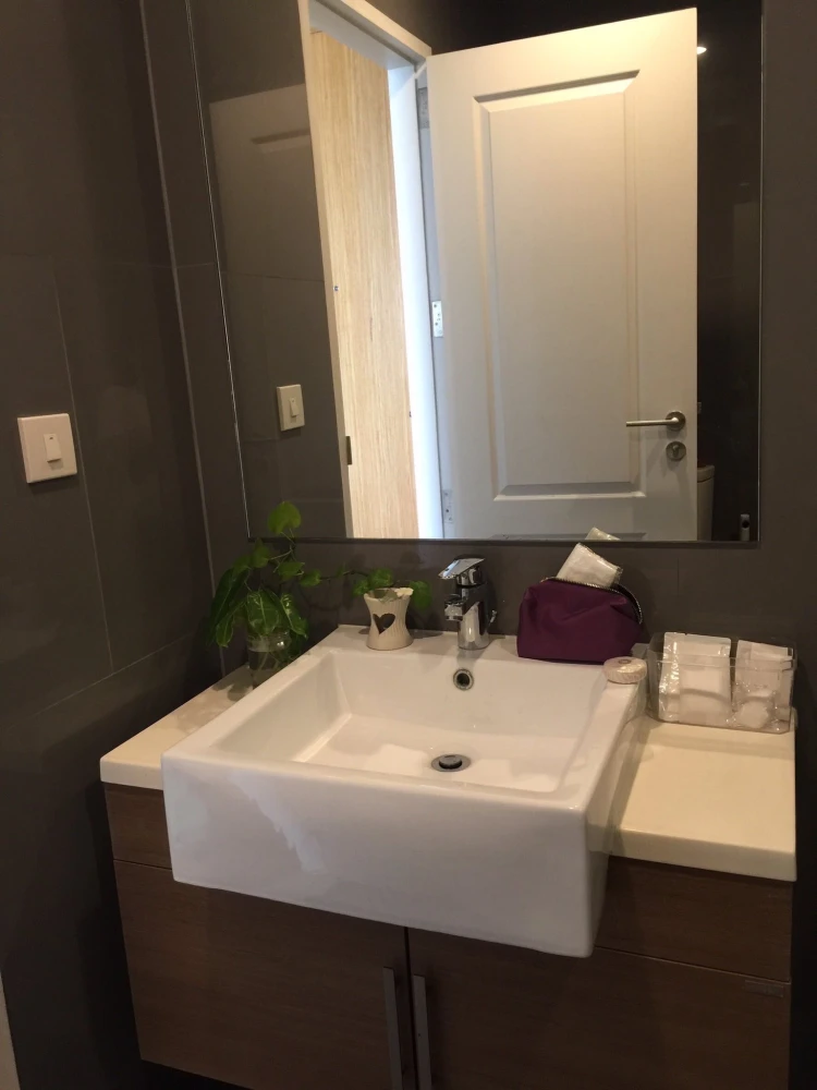 For rent: Noble Revo Silom, very high floor unit, fully furnished and ready to move in. Offers a partial view of the Chao Phraya River. Includes all a