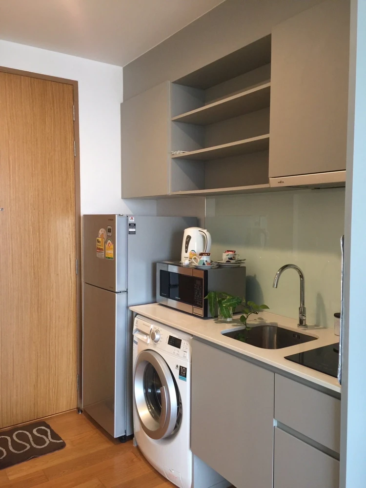 For rent: Noble Revo Silom, very high floor unit, fully furnished and ready to move in. Offers a partial view of the Chao Phraya River. Includes all a