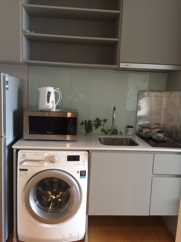 For rent: Noble Revo Silom, very high floor unit, fully furnished and ready to move in. Offers a partial view of the Chao Phraya River. Includes all a