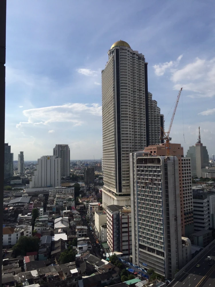 For rent: Noble Revo Silom, very high floor unit, fully furnished and ready to move in. Offers a partial view of the Chao Phraya River. Includes all a