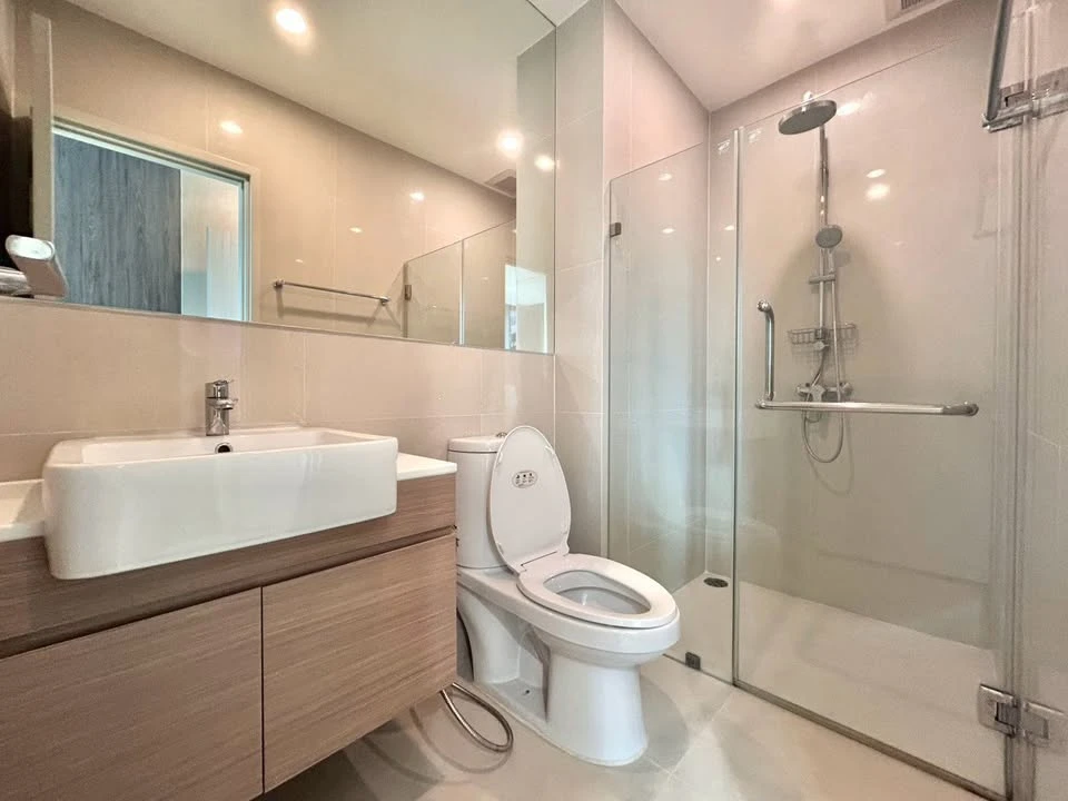 For rent: Noble Revolve Ratchada, 2 bedrooms, spacious living area, prime location. Don't just look, book it!