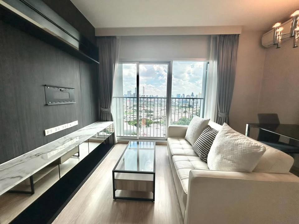For rent: Noble Revolve Ratchada, 2 bedrooms, spacious living area, prime location. Don't just look, book it!