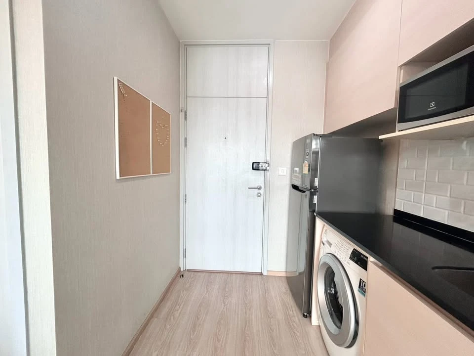 For rent: Noble Revolve Ratchada, 2 bedrooms, spacious living area, prime location. Don't just look, book it!