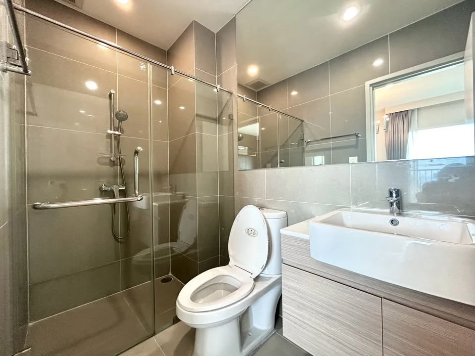 For rent: Noble Revolve Ratchada, 2 bedrooms, spacious living area, prime location. Don't just look, book it!