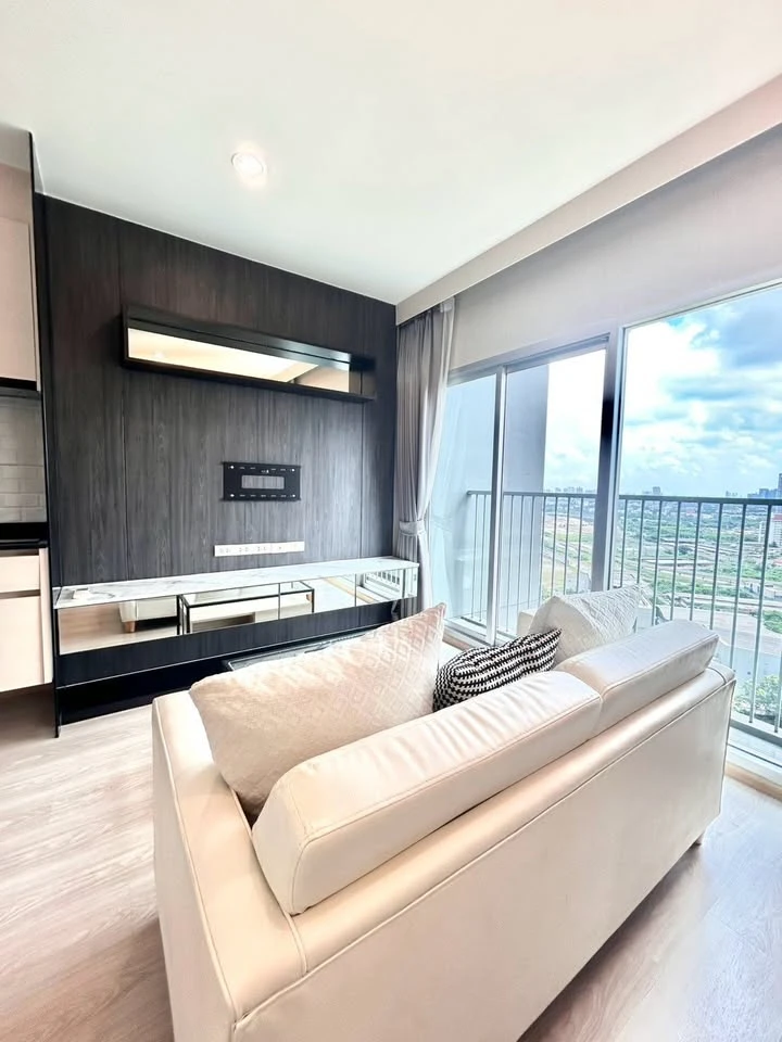 For rent: Noble Revolve Ratchada, 2 bedrooms, spacious living area, prime location. Don't just look, book it!