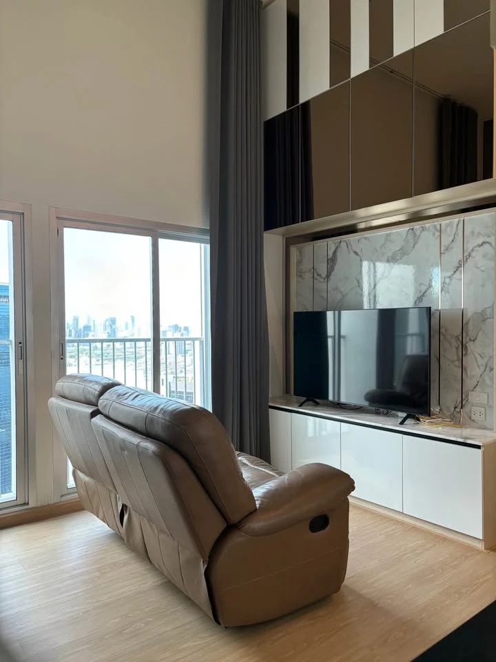 For rent: Noble Revolve Ratchada, top-floor penthouse with unobstructed panoramic views and stunning built-in furnishings. Don't miss out!