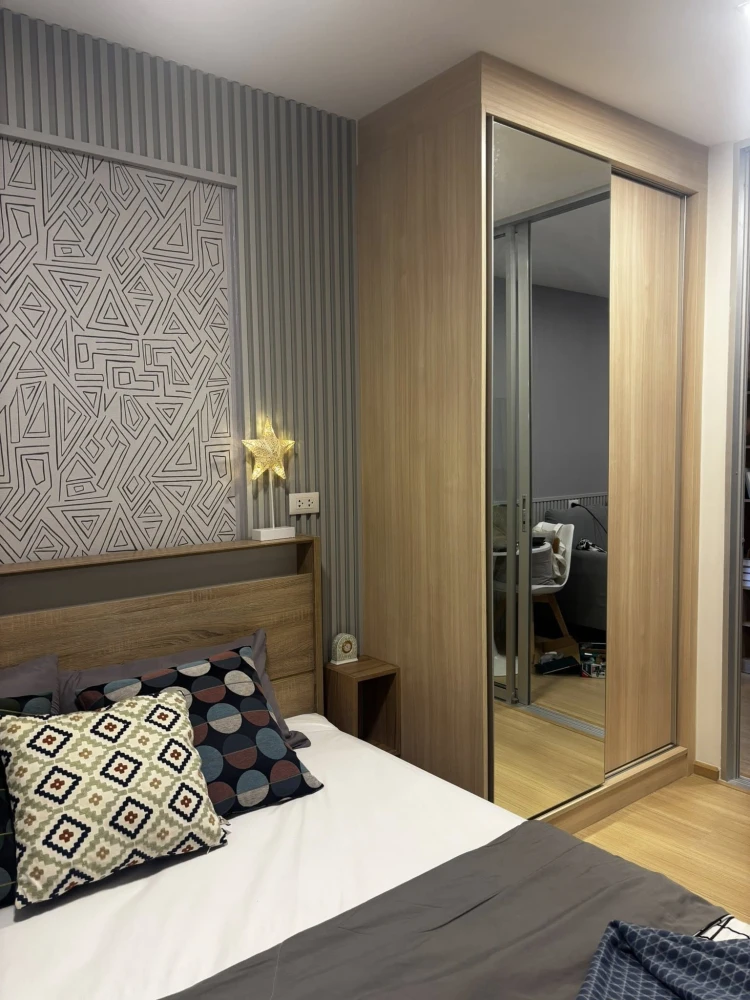 Plum Condo Rangsit Fresh for rent, a cozy room with a theme, well-built walls, and complete furniture. Reserve now!