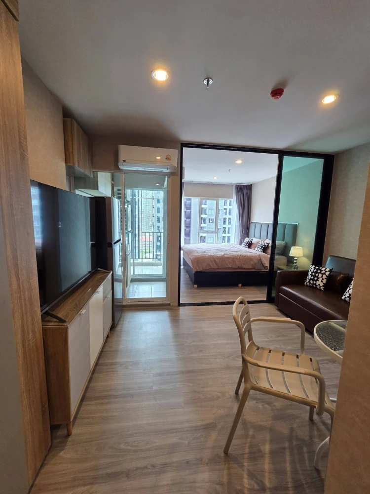 Regent Home Bangna unit for rent. Located on a very high floor, fully furnished, and features a partitioned bedroom with an aluminum frame for a disti