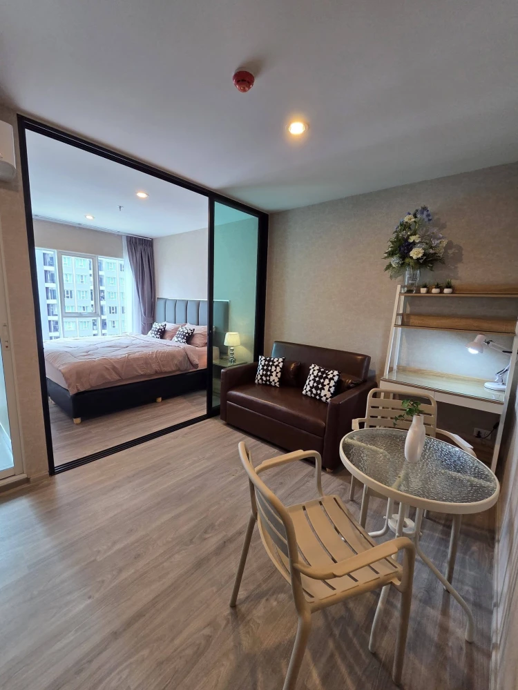 Regent Home Bangna unit for rent. Located on a very high floor, fully furnished, and features a partitioned bedroom with an aluminum frame for a disti
