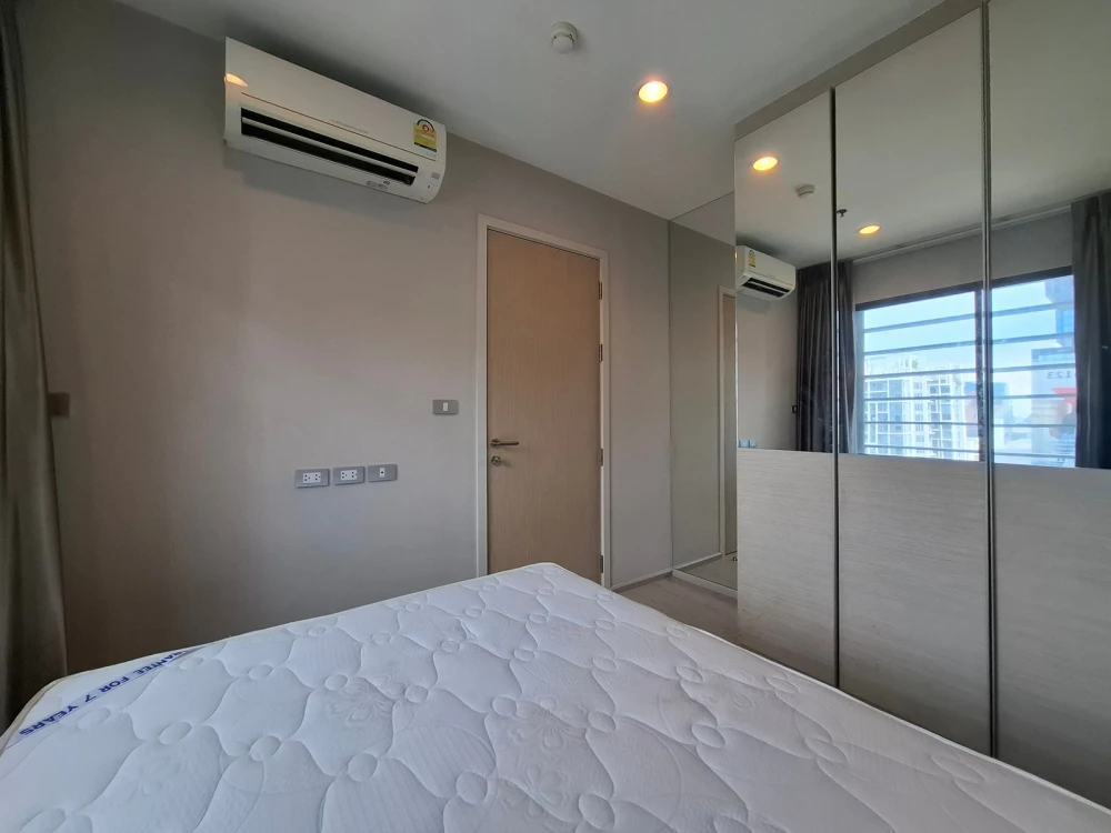 For Rent: Rhythm Asoke 2, 25th floor. High-floor city view, fully furnished, and inviting. Book now if interested!
