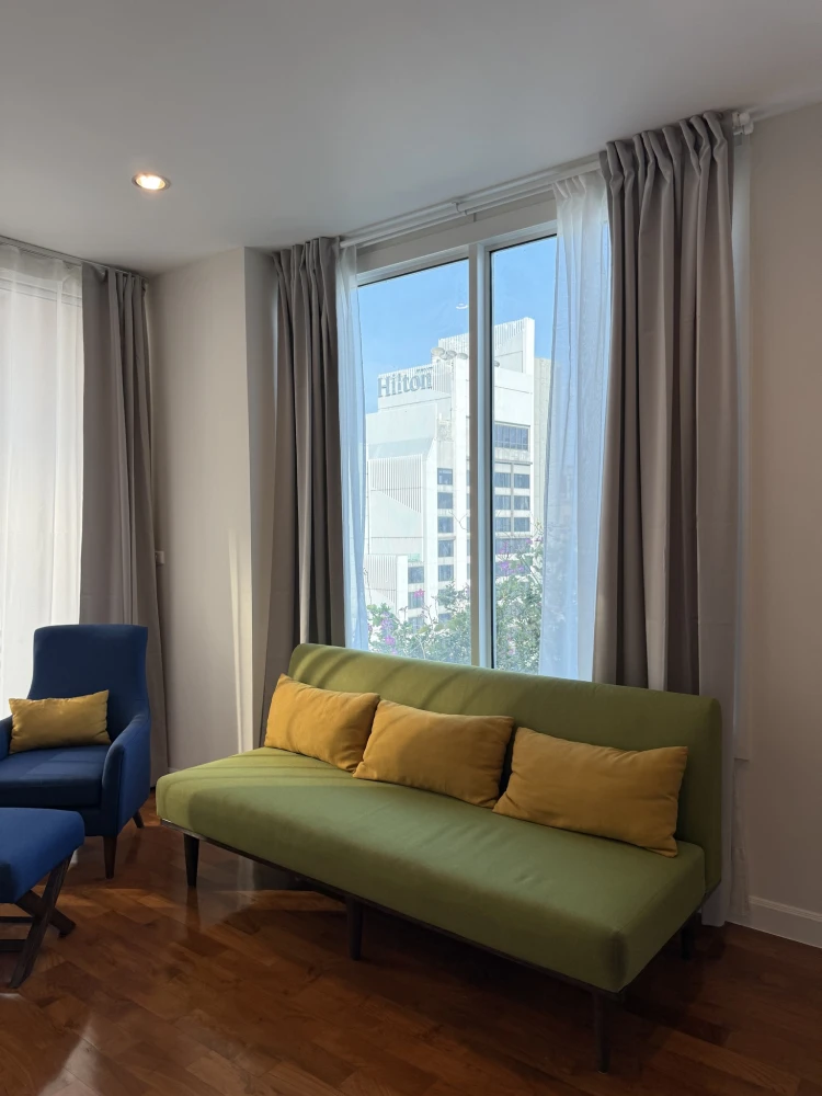 For rent: Siri Residence Sukhumvit 24. Cozy living room and ample storage space. Enjoy beautiful city and garden views from the 25th floor corner unit
