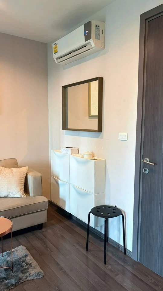 For rent: The Base Park East. The unit features a warm color palette and excellent natural light. From the bedroom, opening the curtains reveals a vie