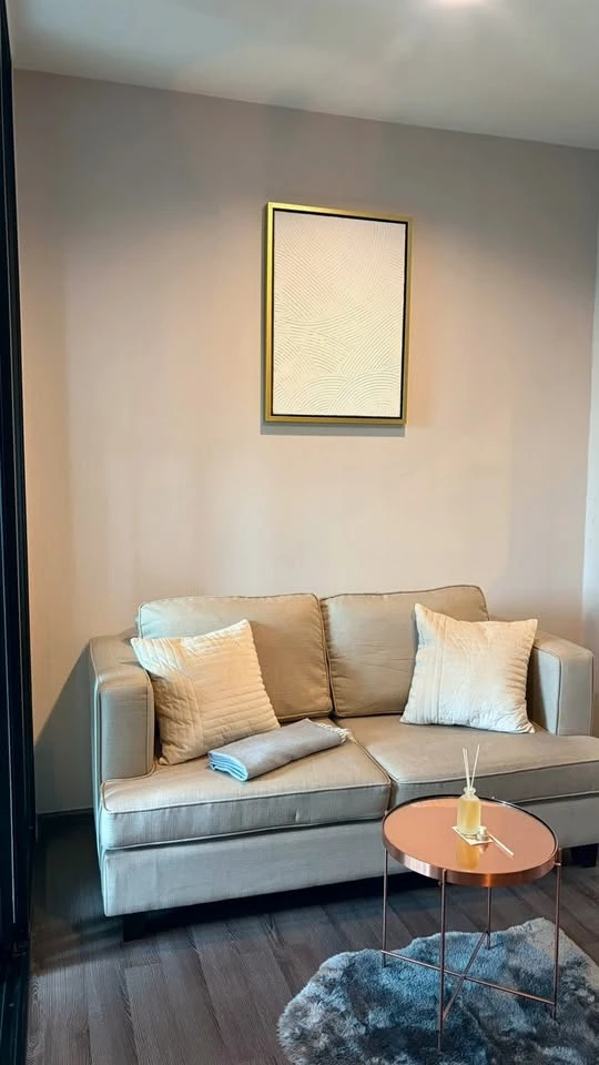 For rent: The Base Park East. The unit features a warm color palette and excellent natural light. From the bedroom, opening the curtains reveals a vie