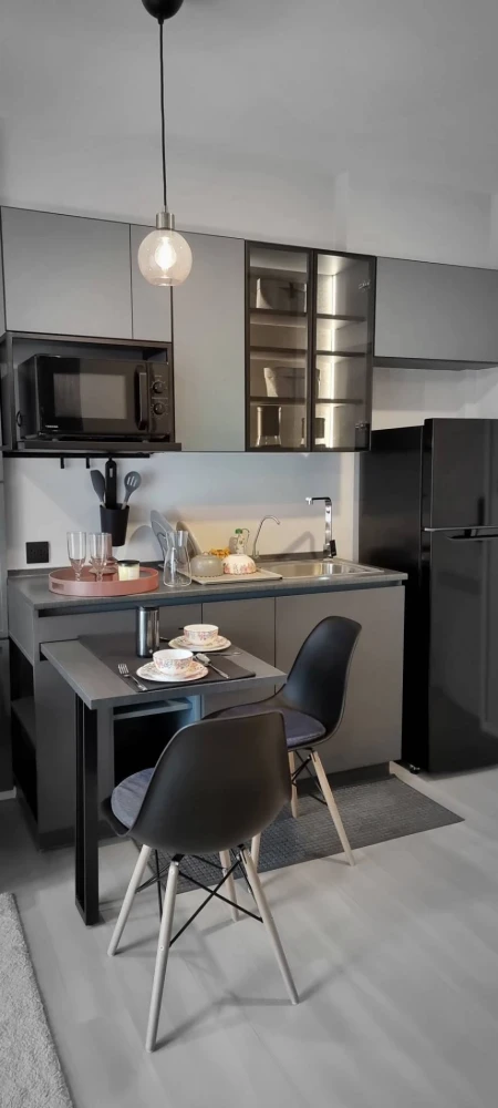 For rent: THE KEY MRT Phetkasem 48, 1-bedroom unit with modern classic built-in furniture. Just bring your belongings and move in.