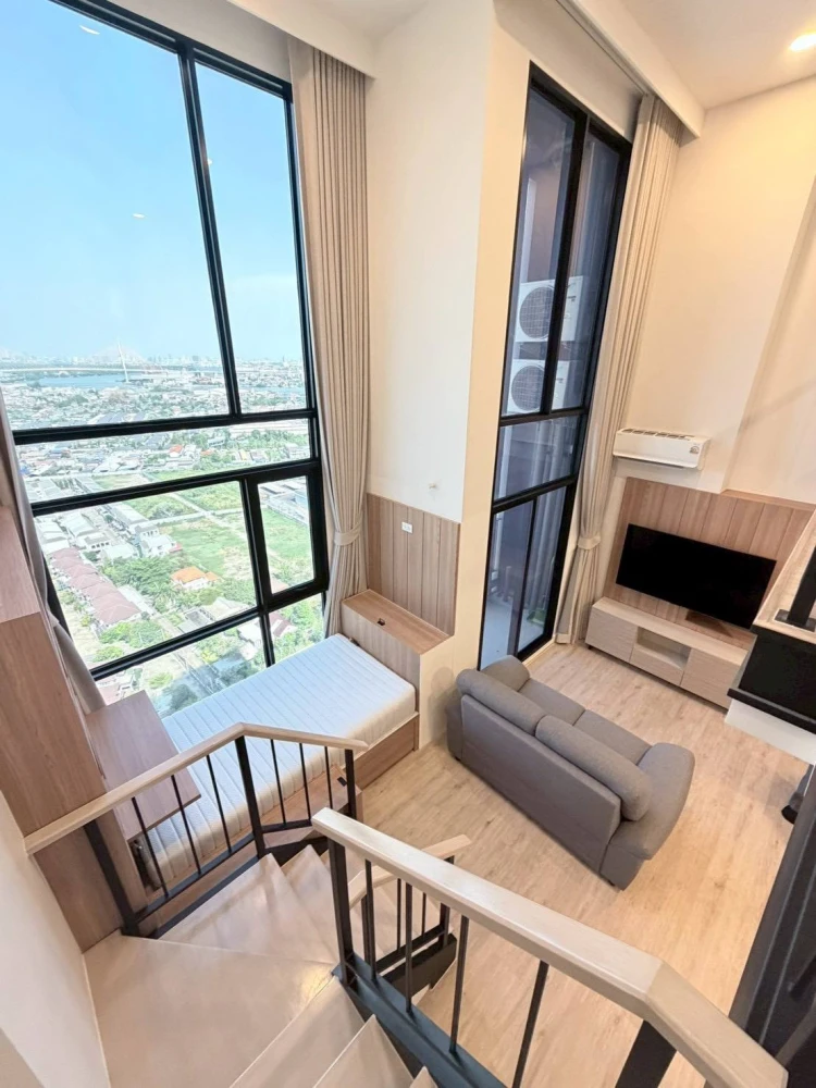 For rent: XIM Suksawat - Rama 3. Spacious room with high ceilings, airy feel, high-quality built-in furniture, and beautiful view. Book now!