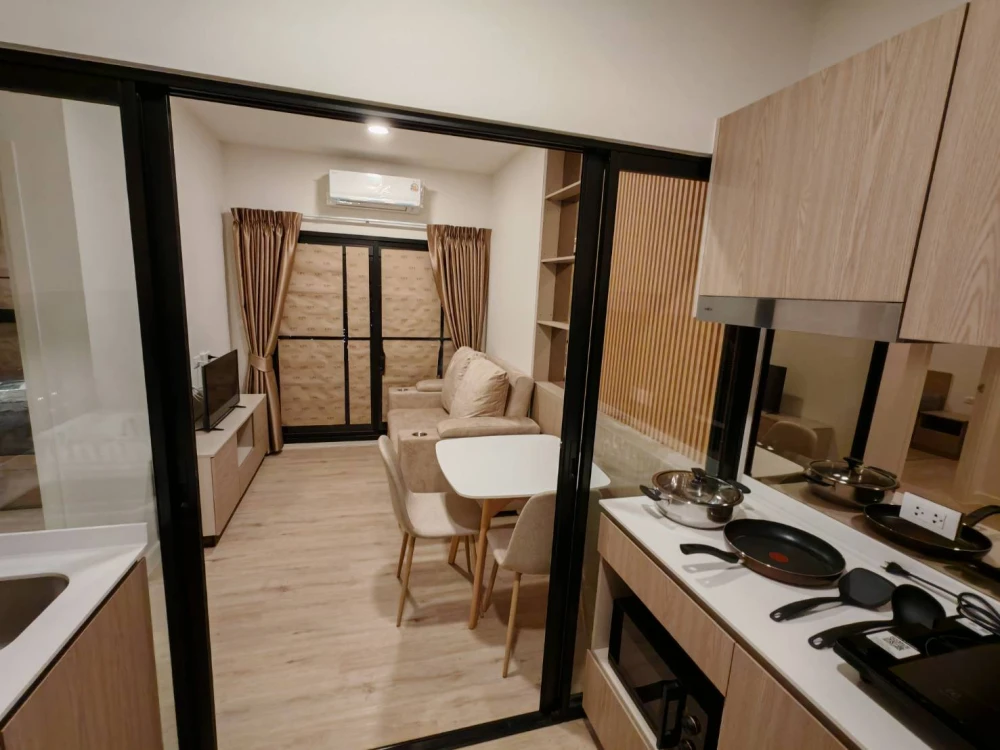 For rent: Xim Suksawat - Rama 3. City and river view from the balcony, no tall buildings obstructing the view. The room is divided into separate zones