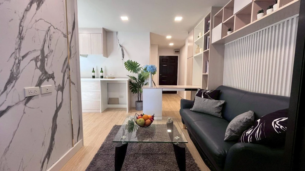 For rent: Champs Elysées Chaengwattana, Building A. Spacious balcony, fully furnished with built-in features. Don't miss this opportunity!