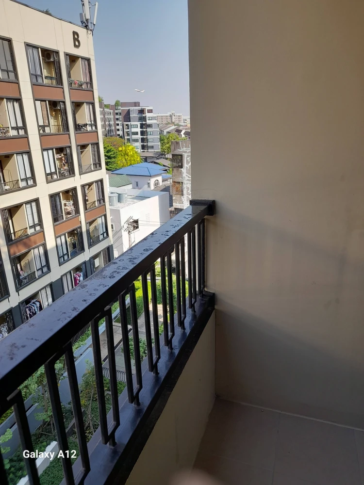Plum Condo Saphan Mai Station for rent. Poolside unit with balcony view of the communal swimming pool. Bedroom and living room are separated.