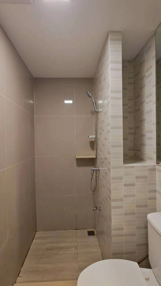 Plum Condo Saphan Mai Station for rent. Poolside unit with balcony view of the communal swimming pool. Bedroom and living room are separated.