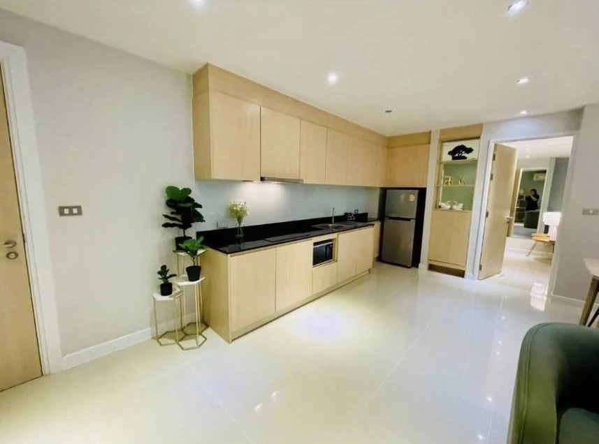 For rent: Grand Caribbean Resort Pattaya, 2 bedrooms, 2 bathrooms, 1st floor, back of the room, open to walk directly into the water park pool. If you
