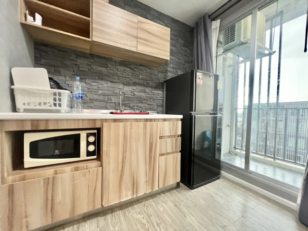 For Rent: Happy Condo Don Mueang The Terminal. Features a relaxing pool view and high-quality wallpaper throughout the unit. Snap it up fast!