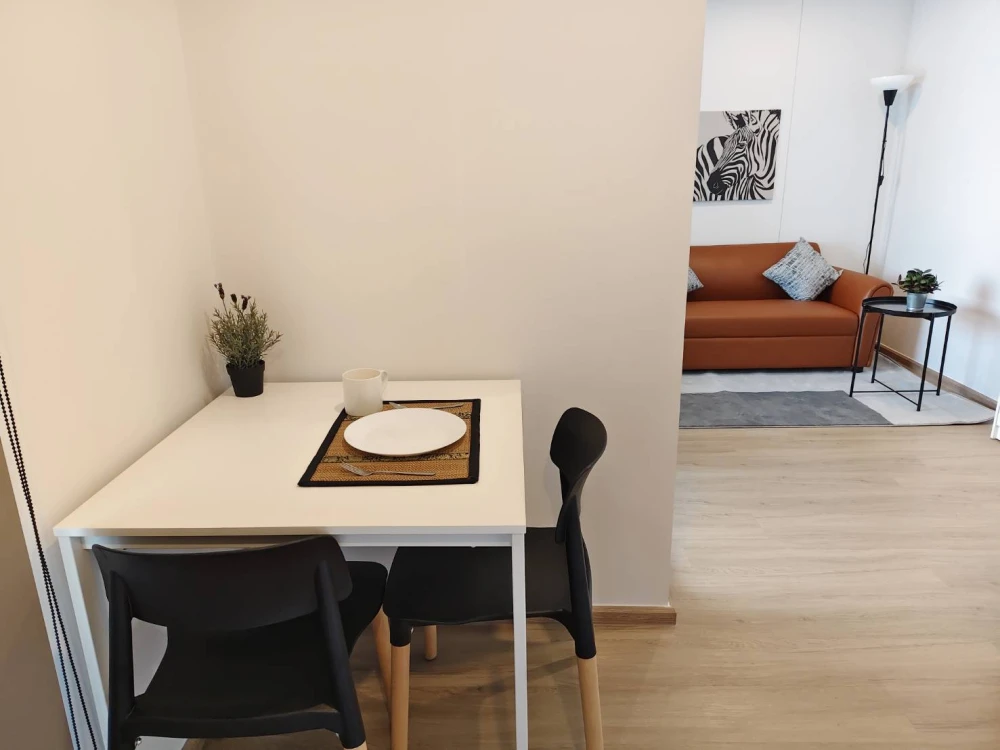 Condo for rent at Hi Rise Ratchayothin Station. Spacious and airy unit with a separate bedroom area via sliding glass doors. Book now!