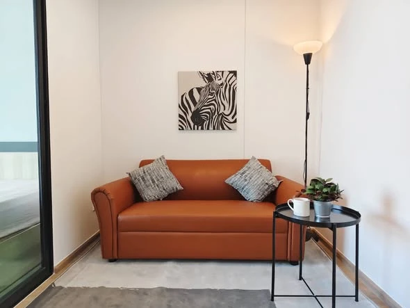 Condo for rent at Hi Rise Ratchayothin Station. Spacious and airy unit with a separate bedroom area via sliding glass doors. Book now!